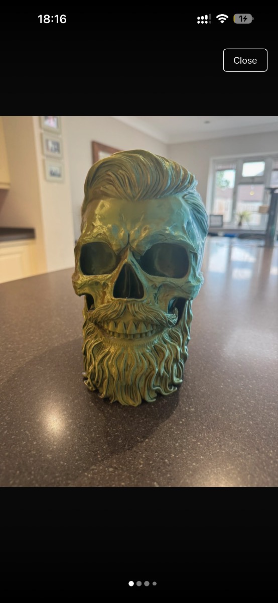 A 3D printed bearded Skull Headphone stand