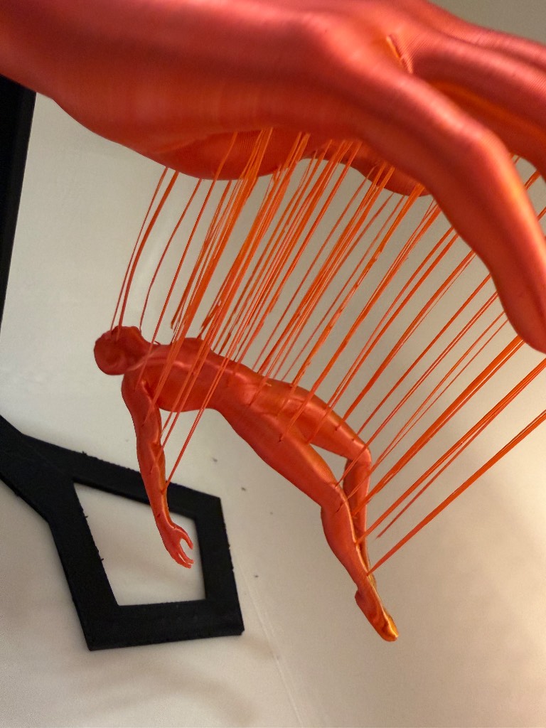 Plastic ornament - suspended human body