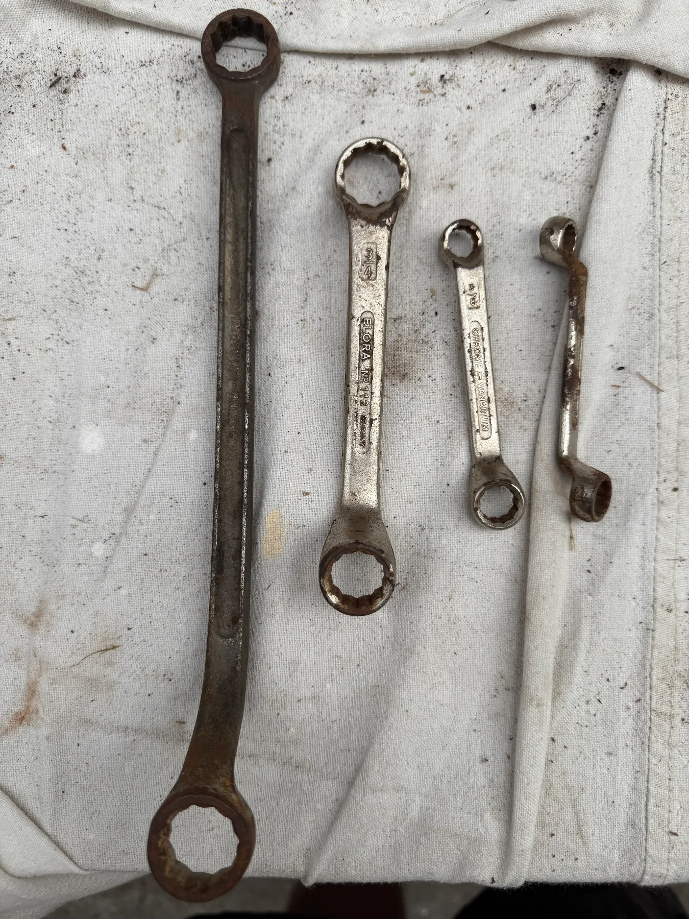 A set of four vintage double-ended ring spanners