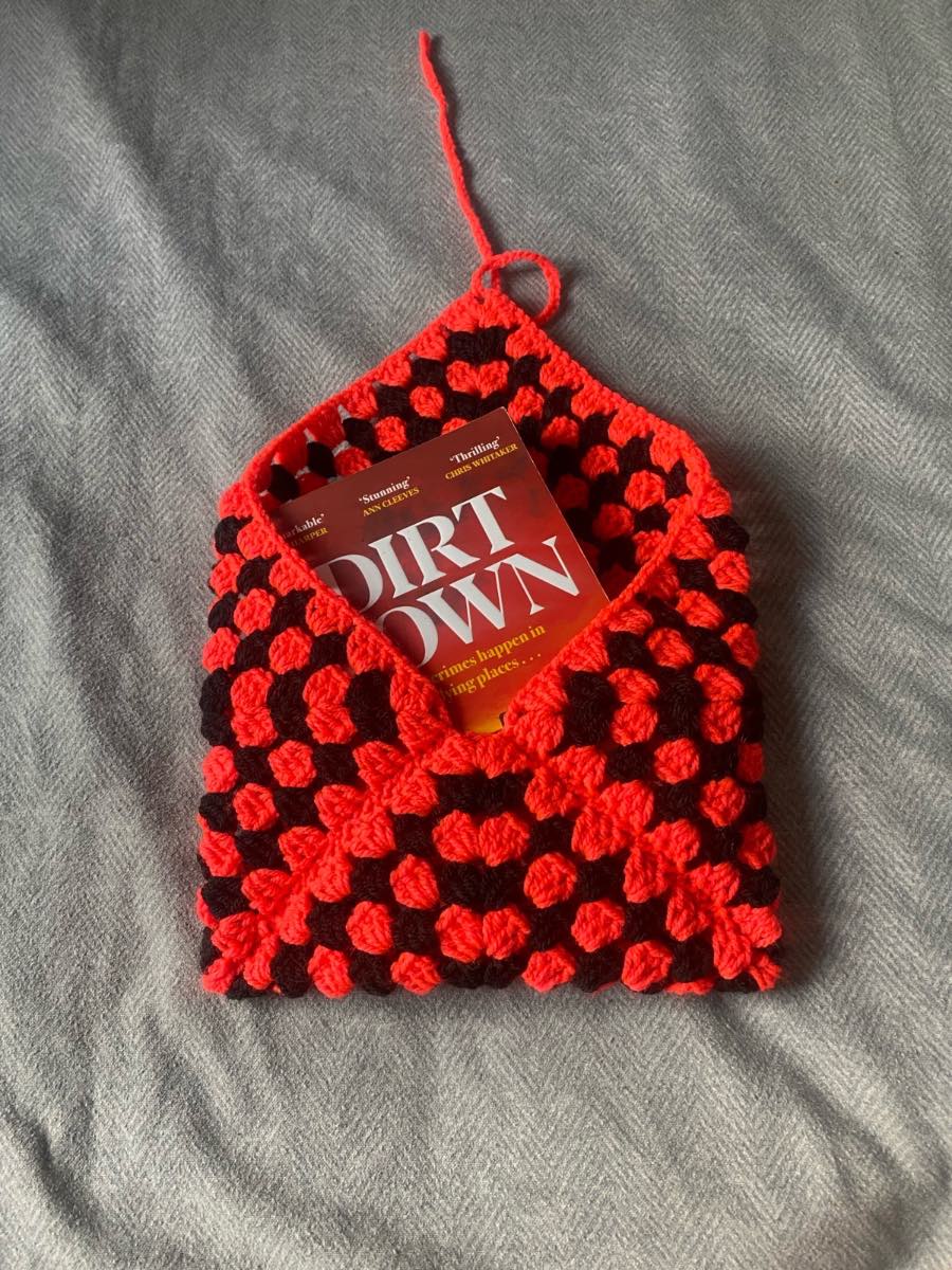 Crocheted Coral And Black Book Sleeve