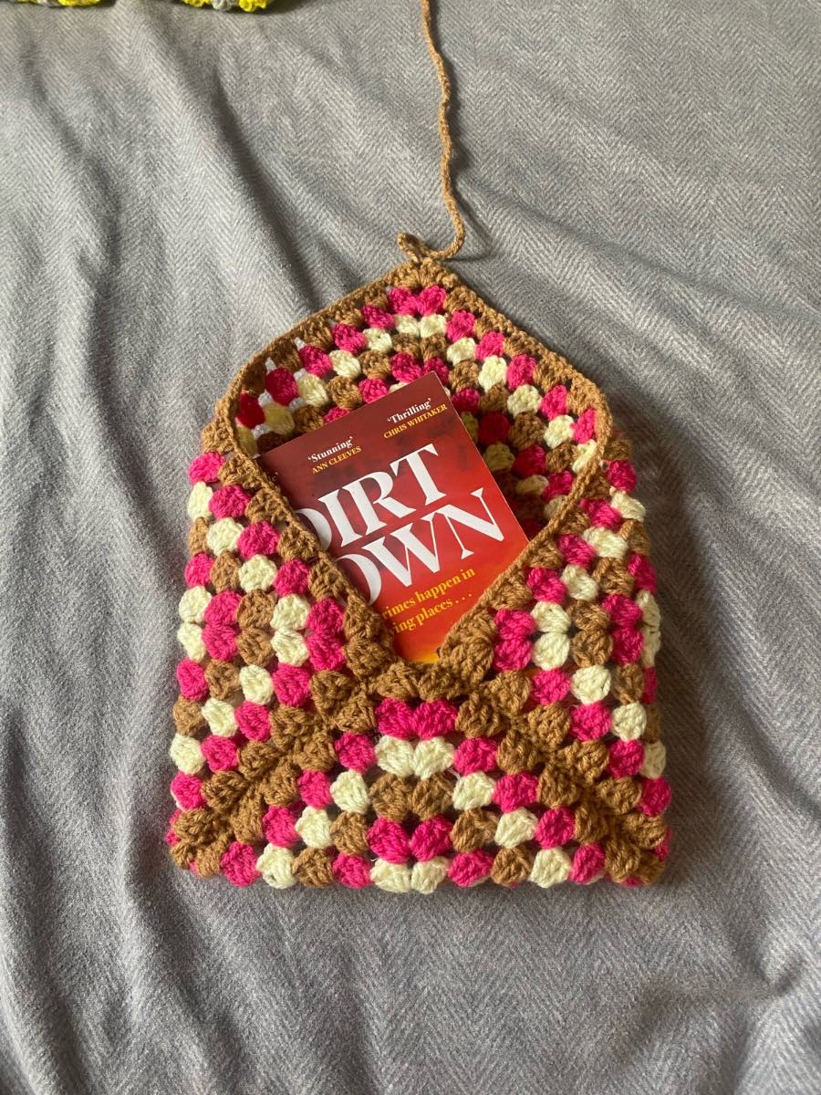 Crocheted Brown, Pink And Pastel Yellow Book Sleeve