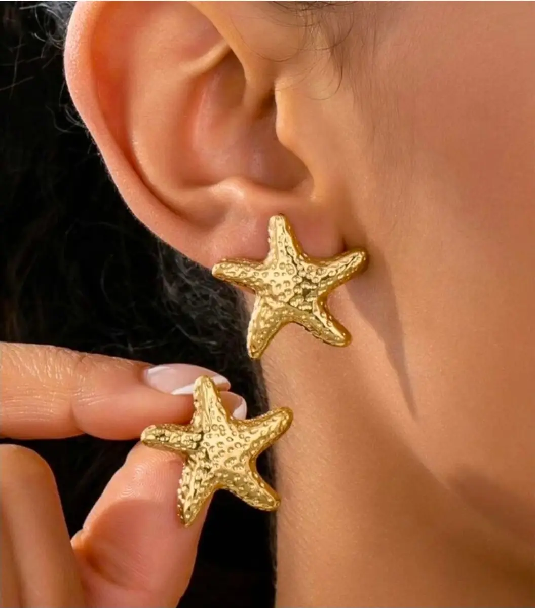 gold starfish stud earrings.