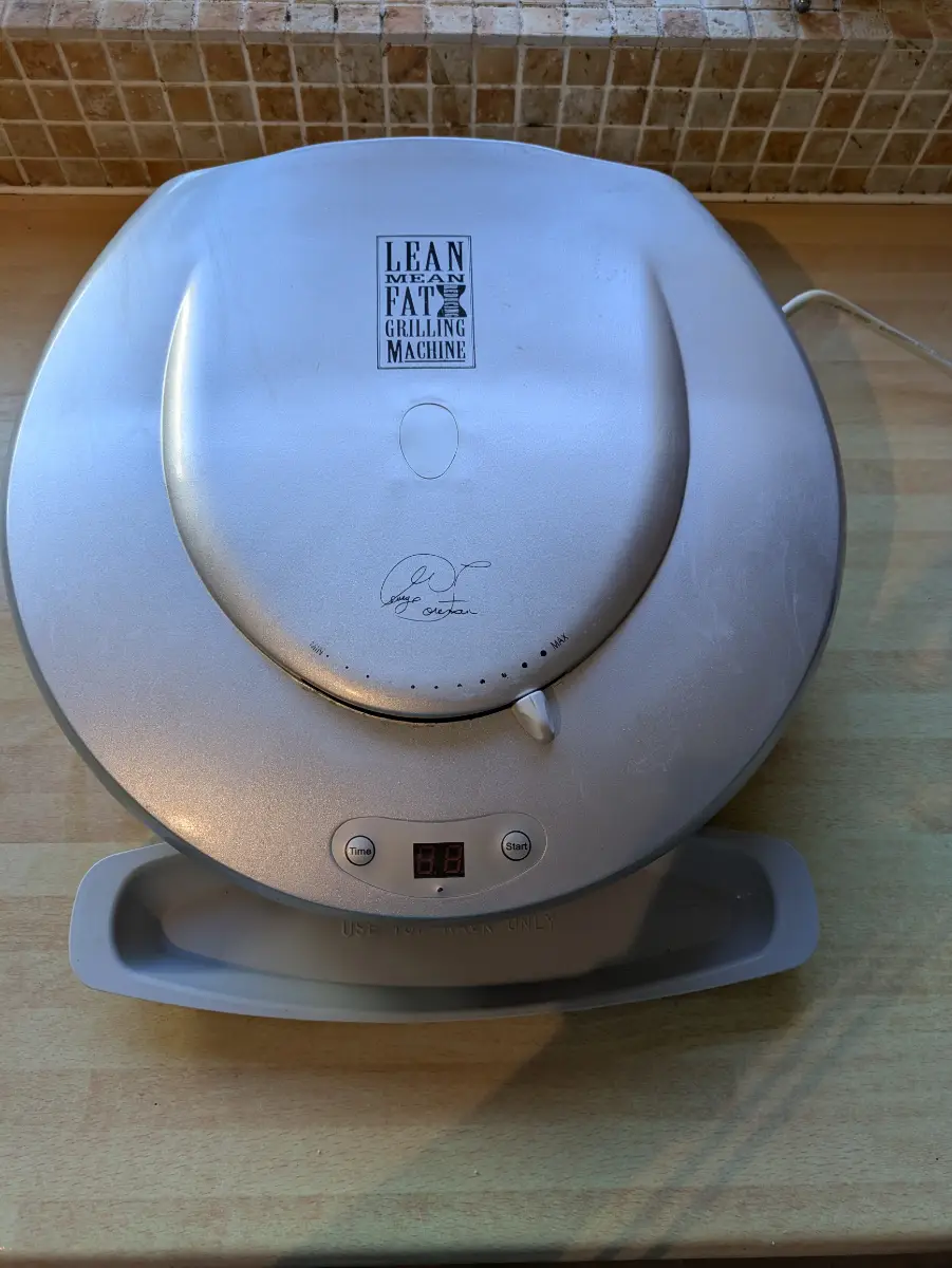 George Foreman Grill with drip tray & instructions. GR30VTTSIL. Model no: 10099