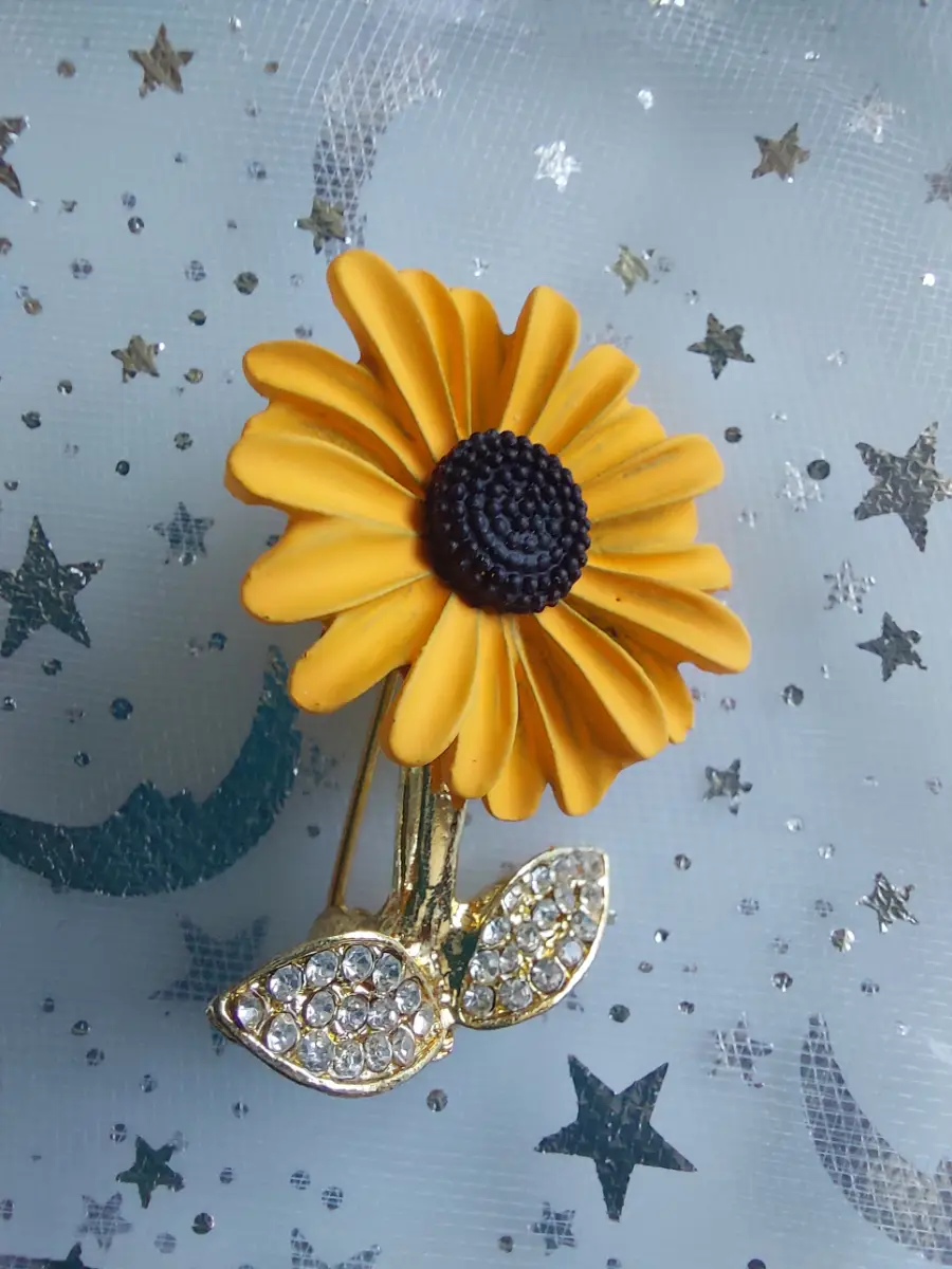 Sunflower brooch with sparkling leaves