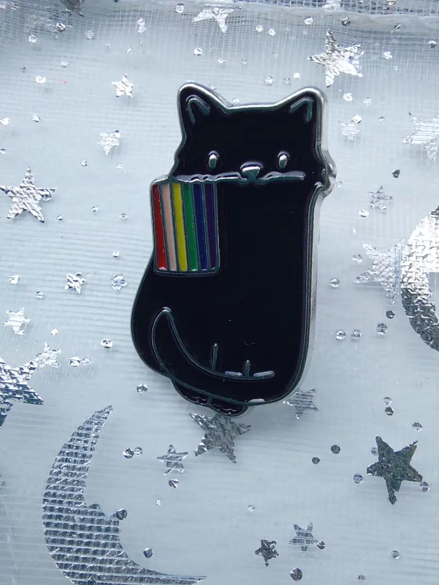 Pride kitty pin - cute black cat holding a Pride flag