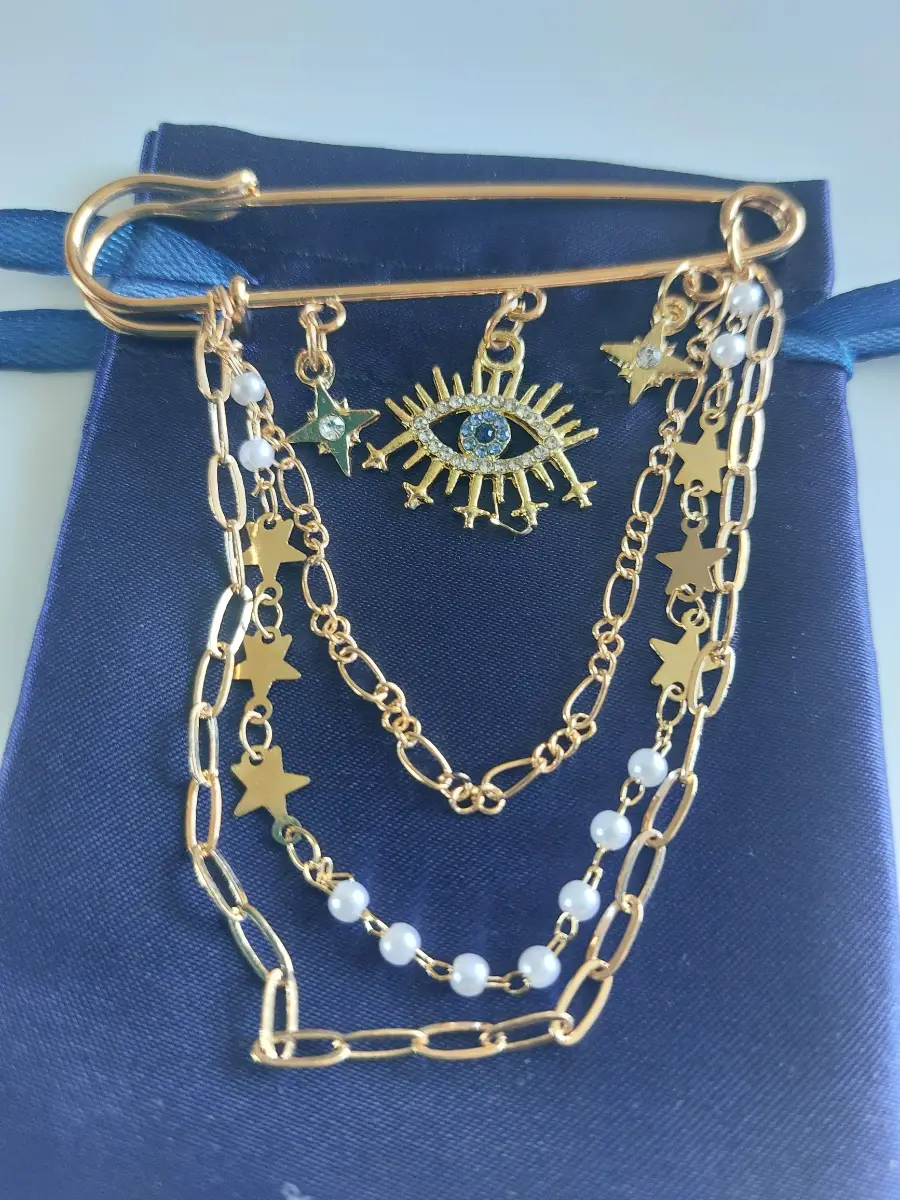 Evil eye chain and pin brooch - very striking!