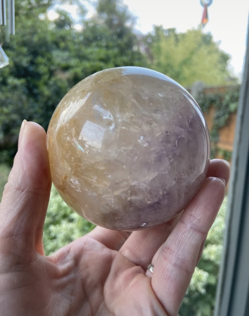 Large amethyst with golden healer and a gate inclusions crystal sphere
