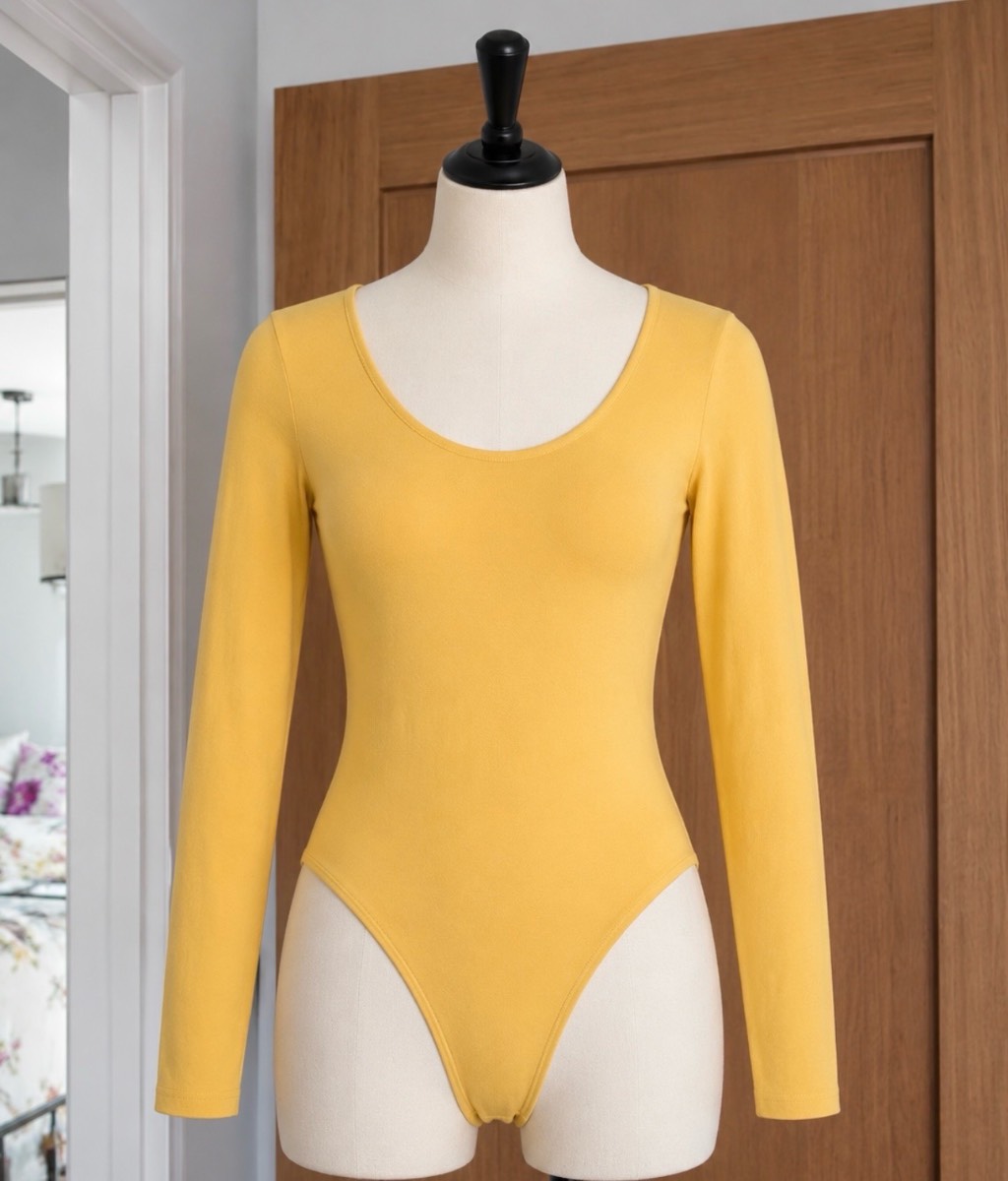 Yellow long sleeve body suit size 8