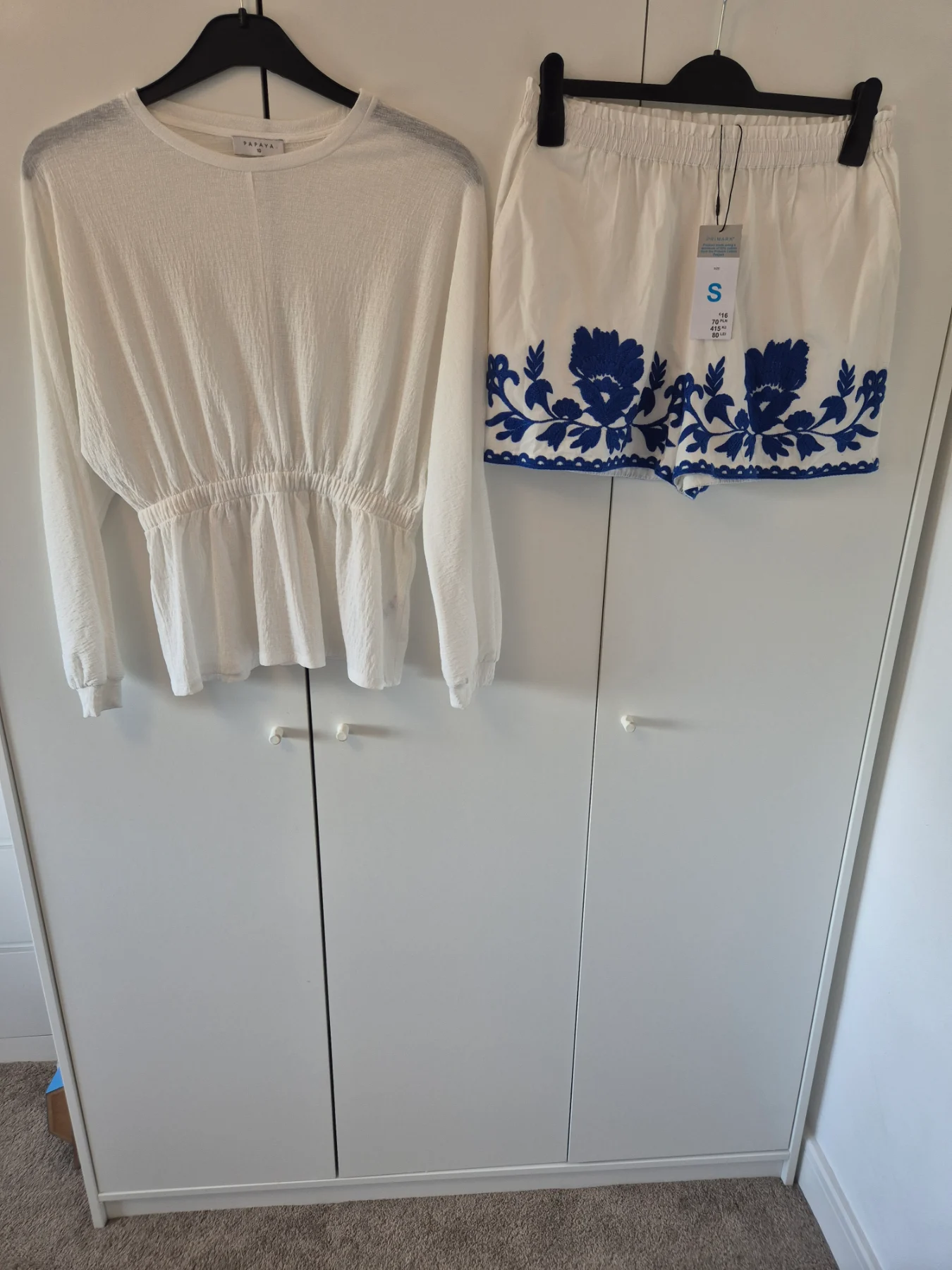 Gorgeous top with tie and white and blue embroidered detail shorts