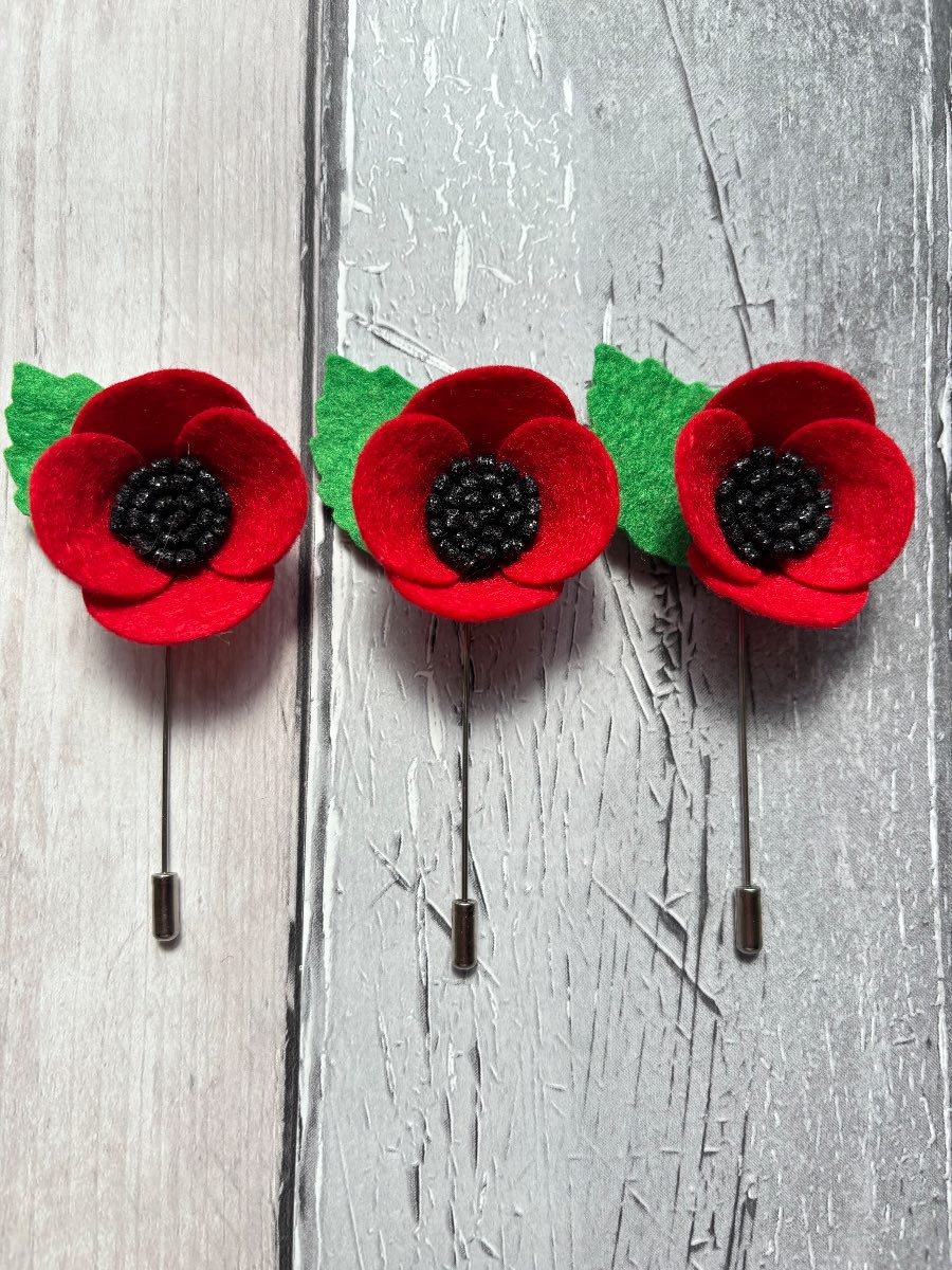 Three felt poppy lapel pins