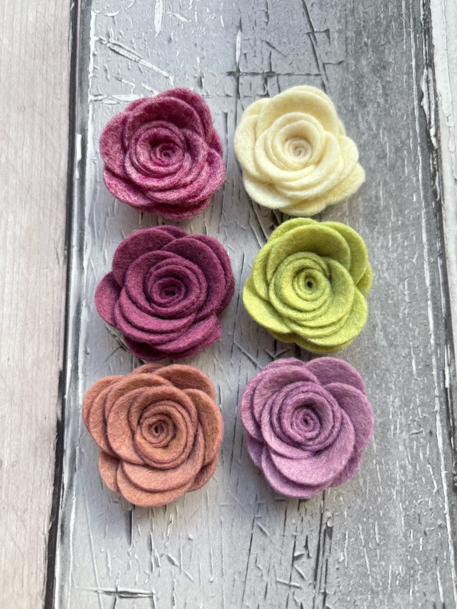 Six felt flowers in neutral colours