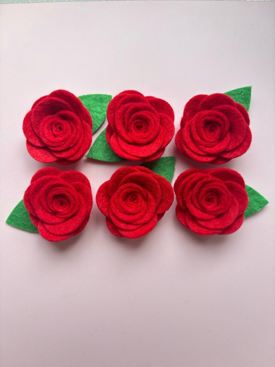 Six small felt red roses