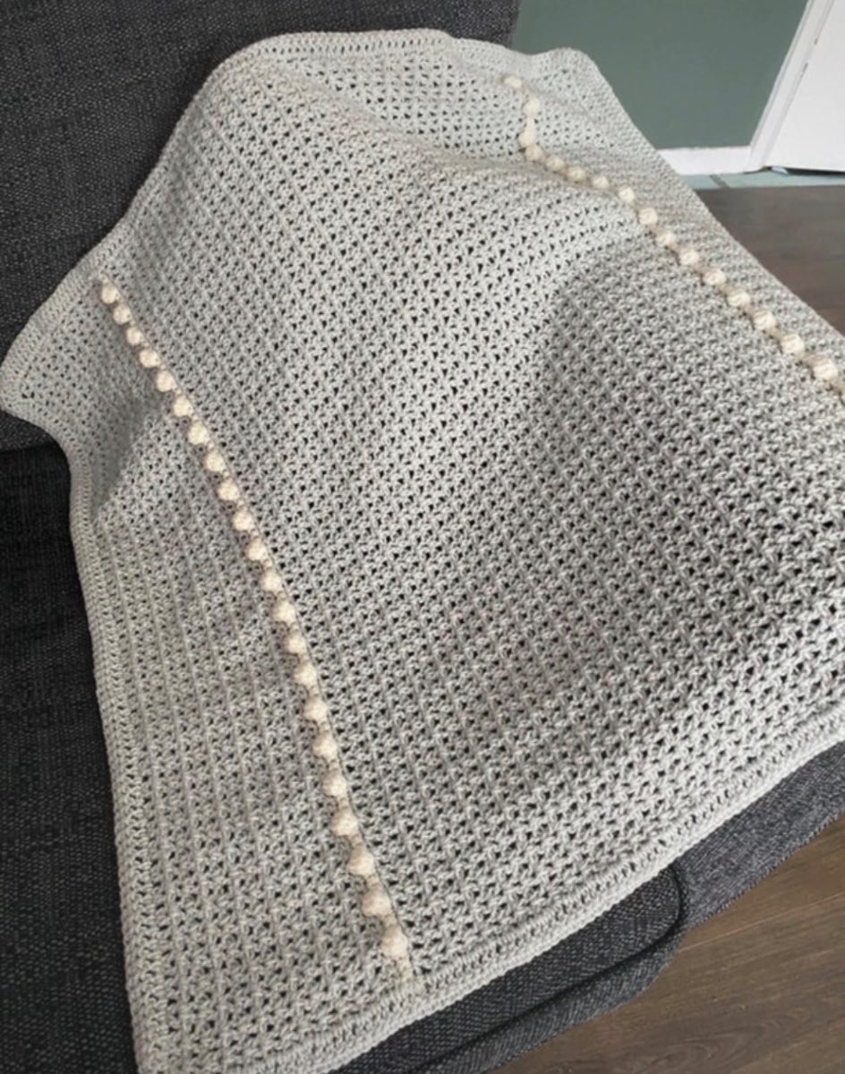Light blue and white blanket