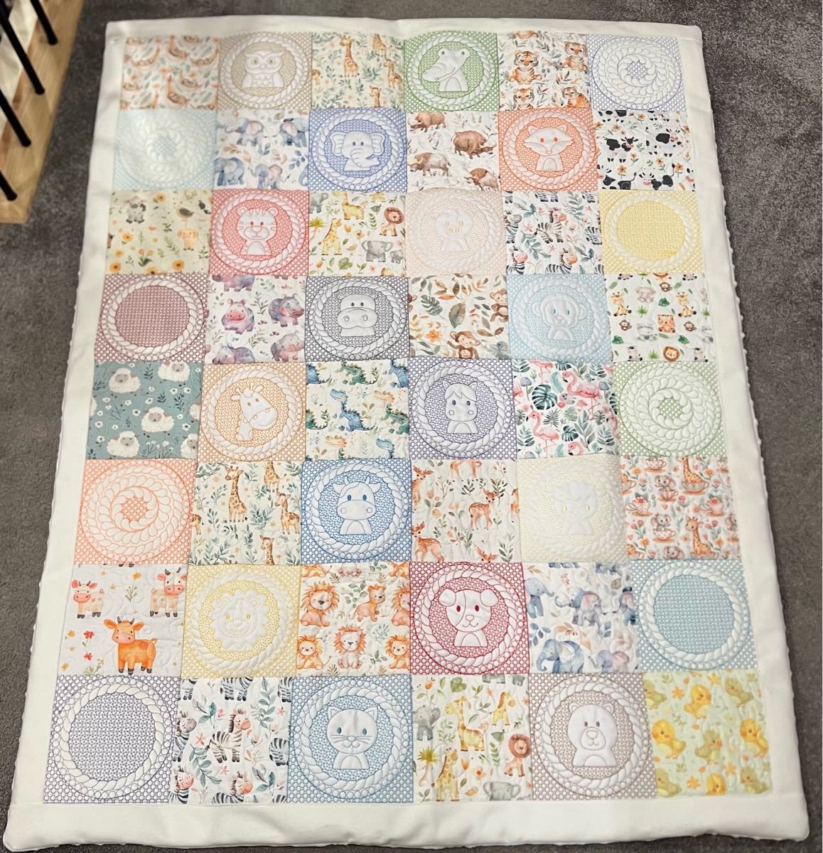 Patchwork animal tummy time blanket