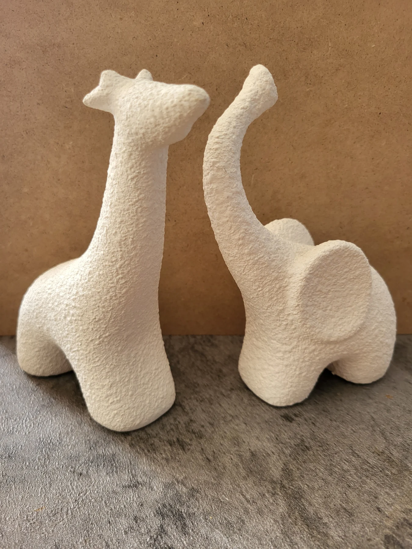Elephant and Giraffe ceramic ornaments