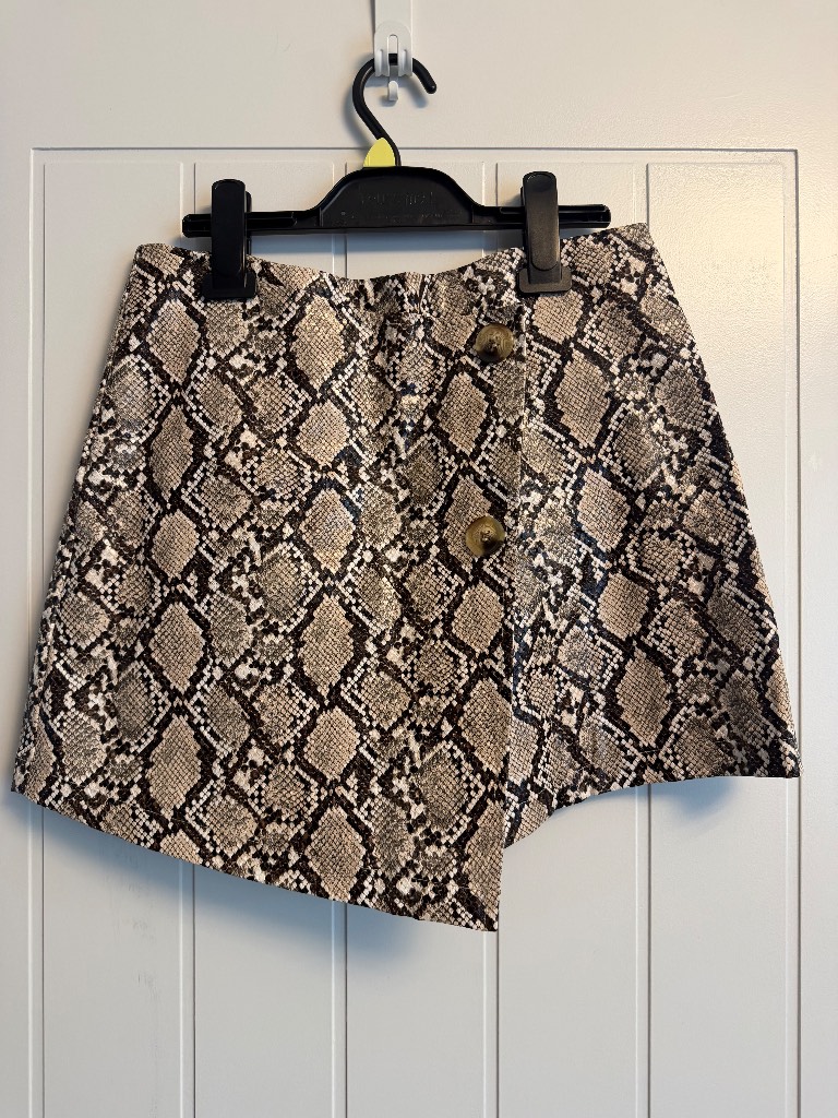 This is a Boohoo snake print asymmetric skort/skirt in UK 10