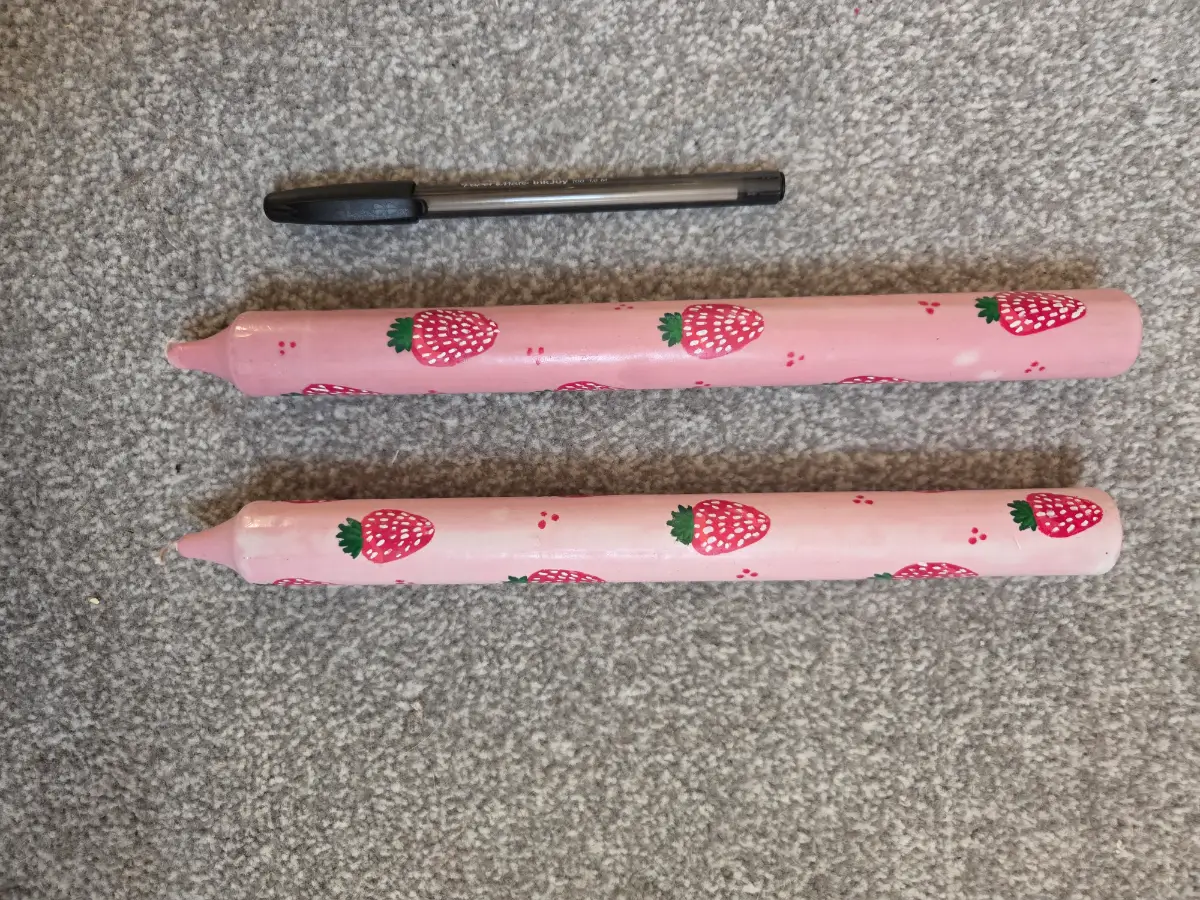 Pink pillar candles with strawberries
