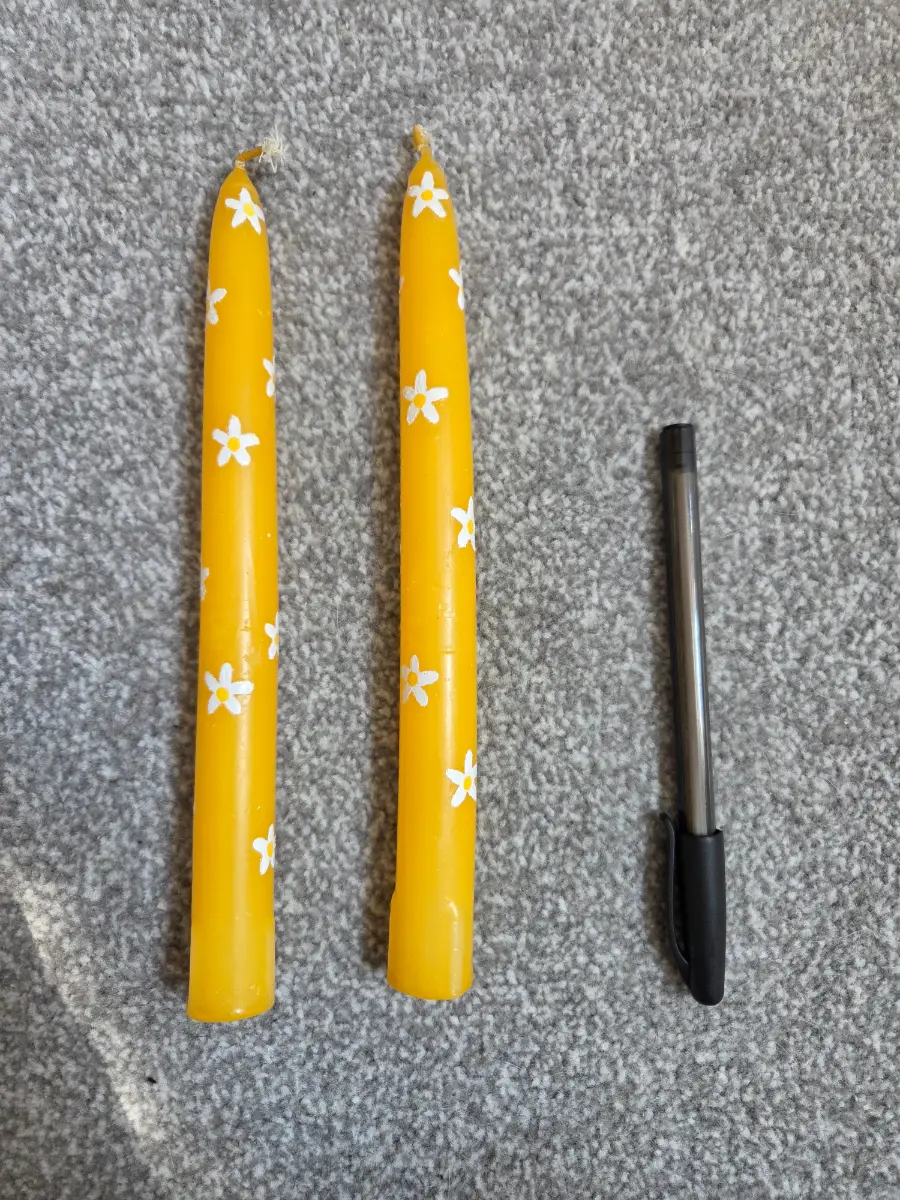 Yellow taper candles with flowers 💐