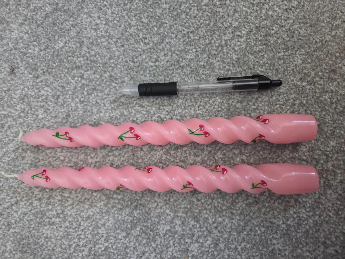 Twisted pink cherry taper candles