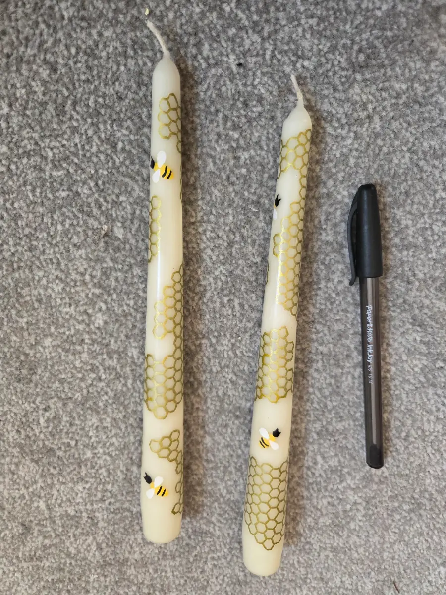 Honeycomb and bees on taper candles