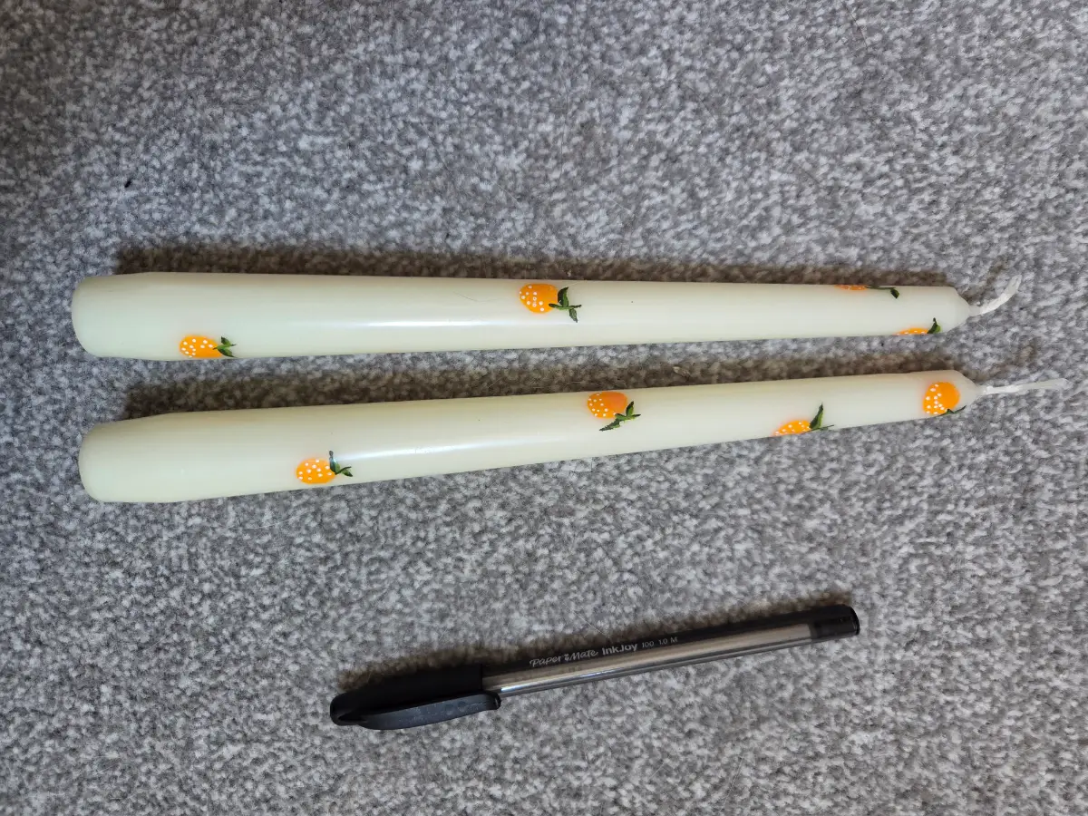 Mini oranges on cream taper candles