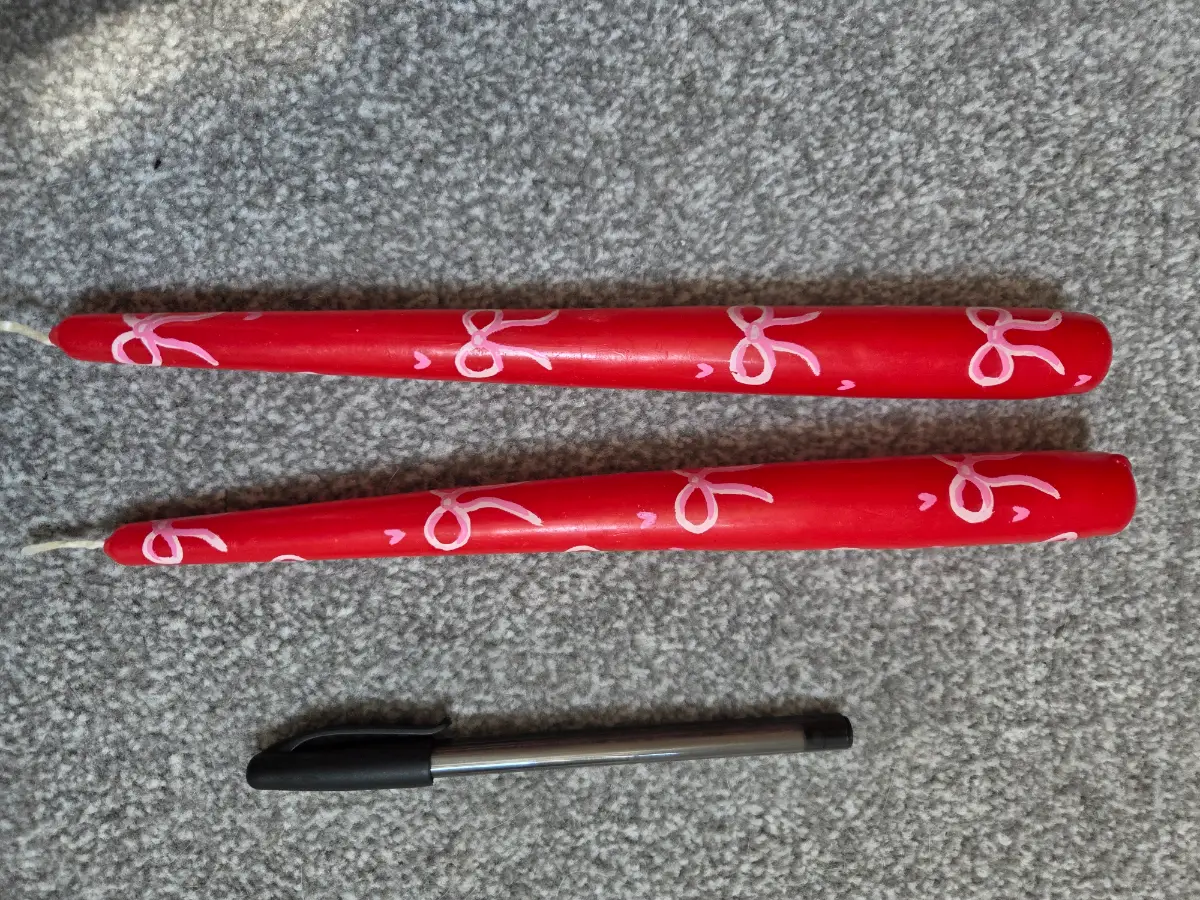Red taper candles with pretty bows
