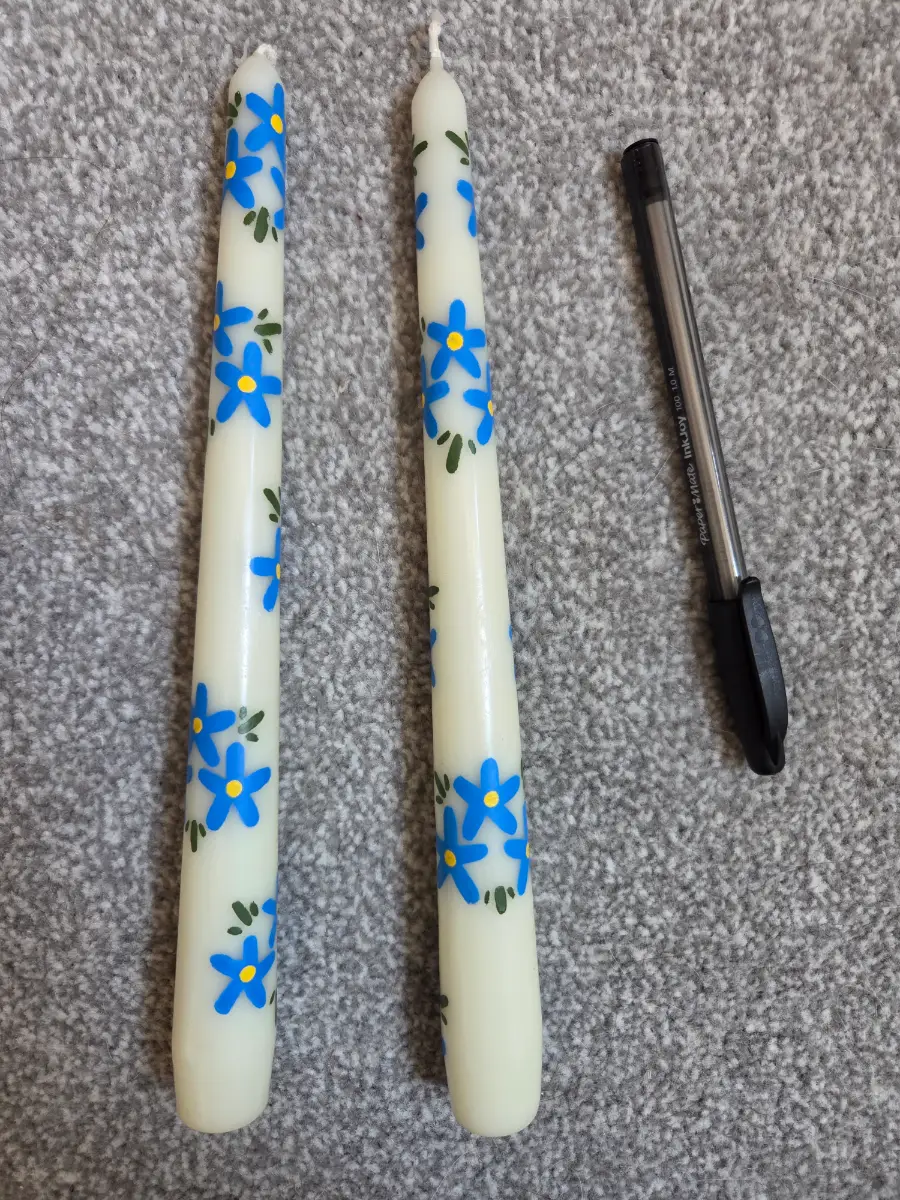 Blue flowers on cream taper candles