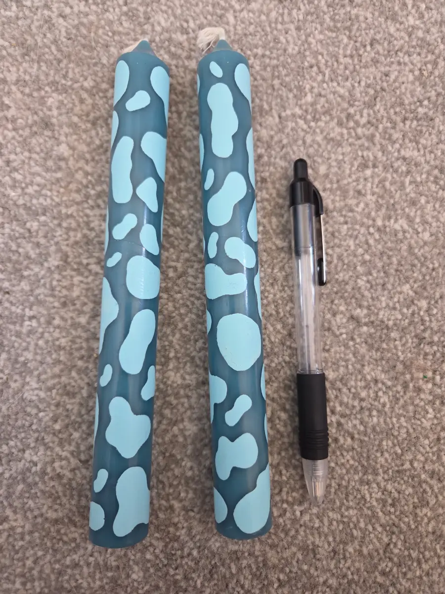 Blue taper cow print candles