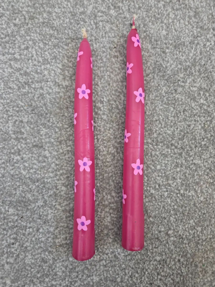 Pink taper candles with pink flowers
