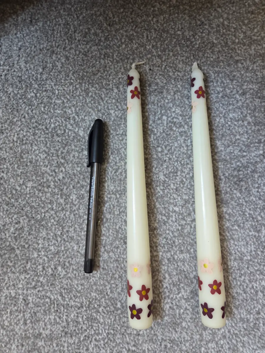Brown flowers on taper candles