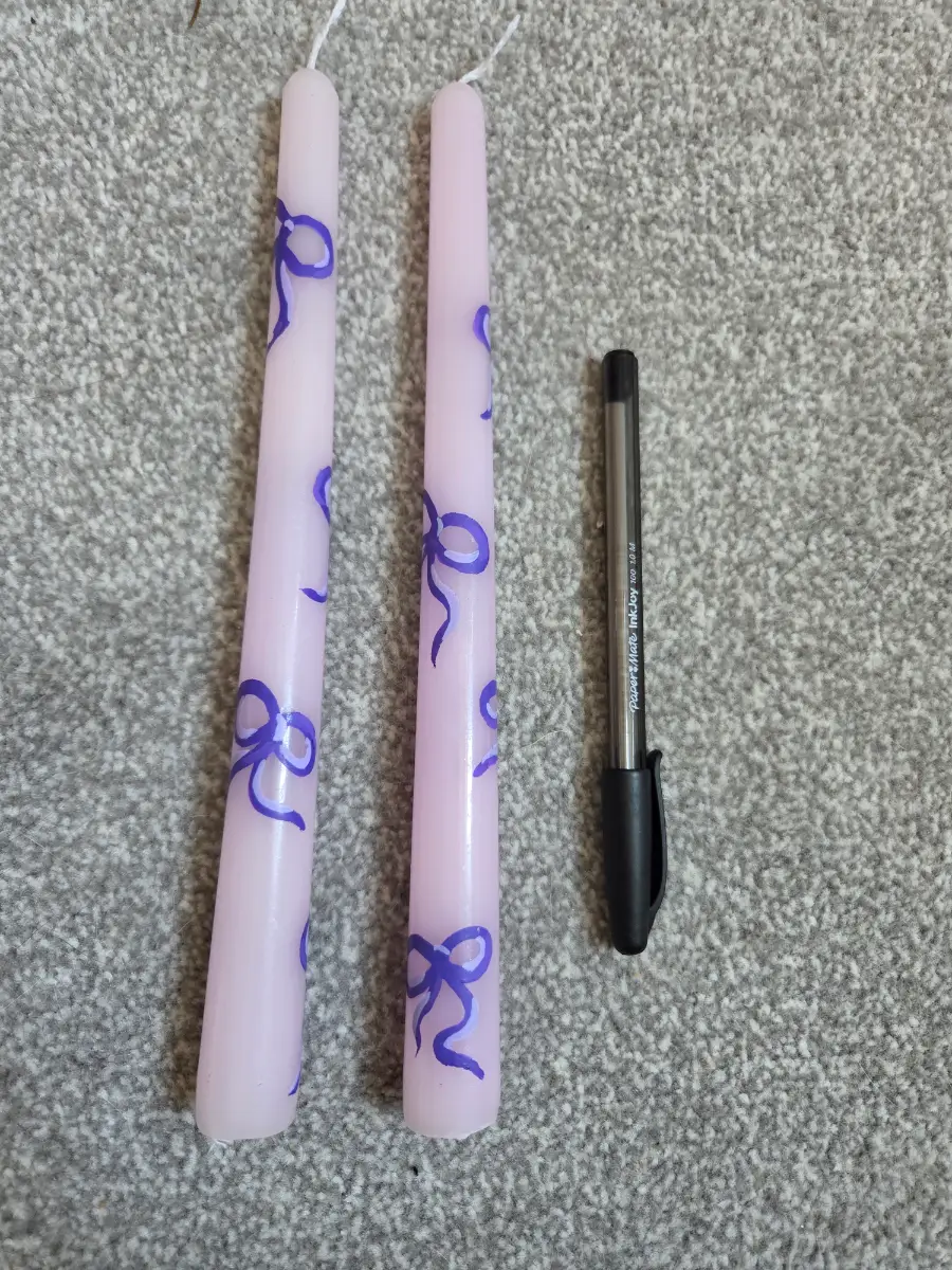 Lilac taper candles with purple bow