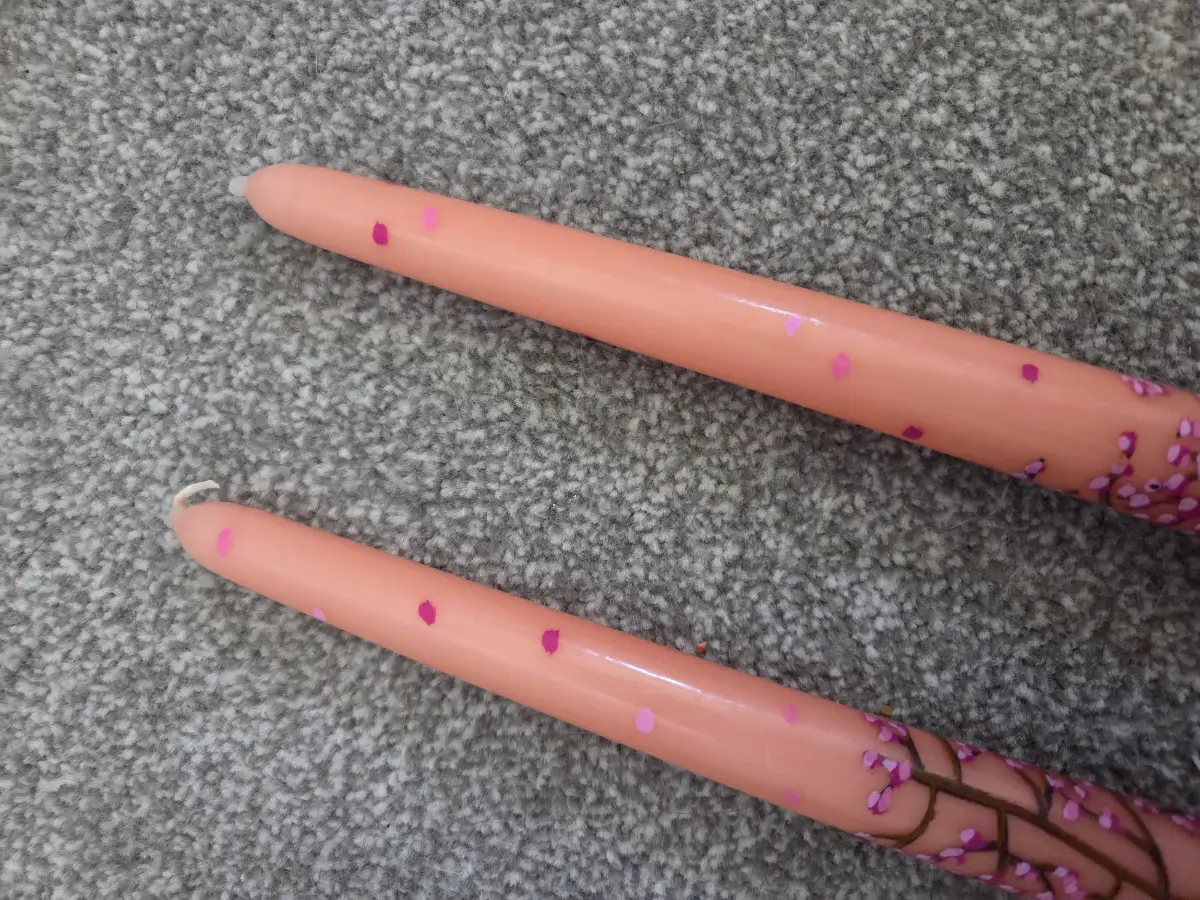 Cherry blossom on peach coloured taper candles