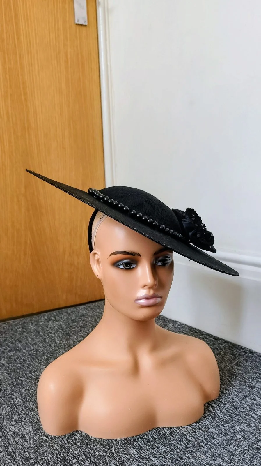 Black fascinator hat with beads embellishment and a sequin bow perfect for special occasions wedding