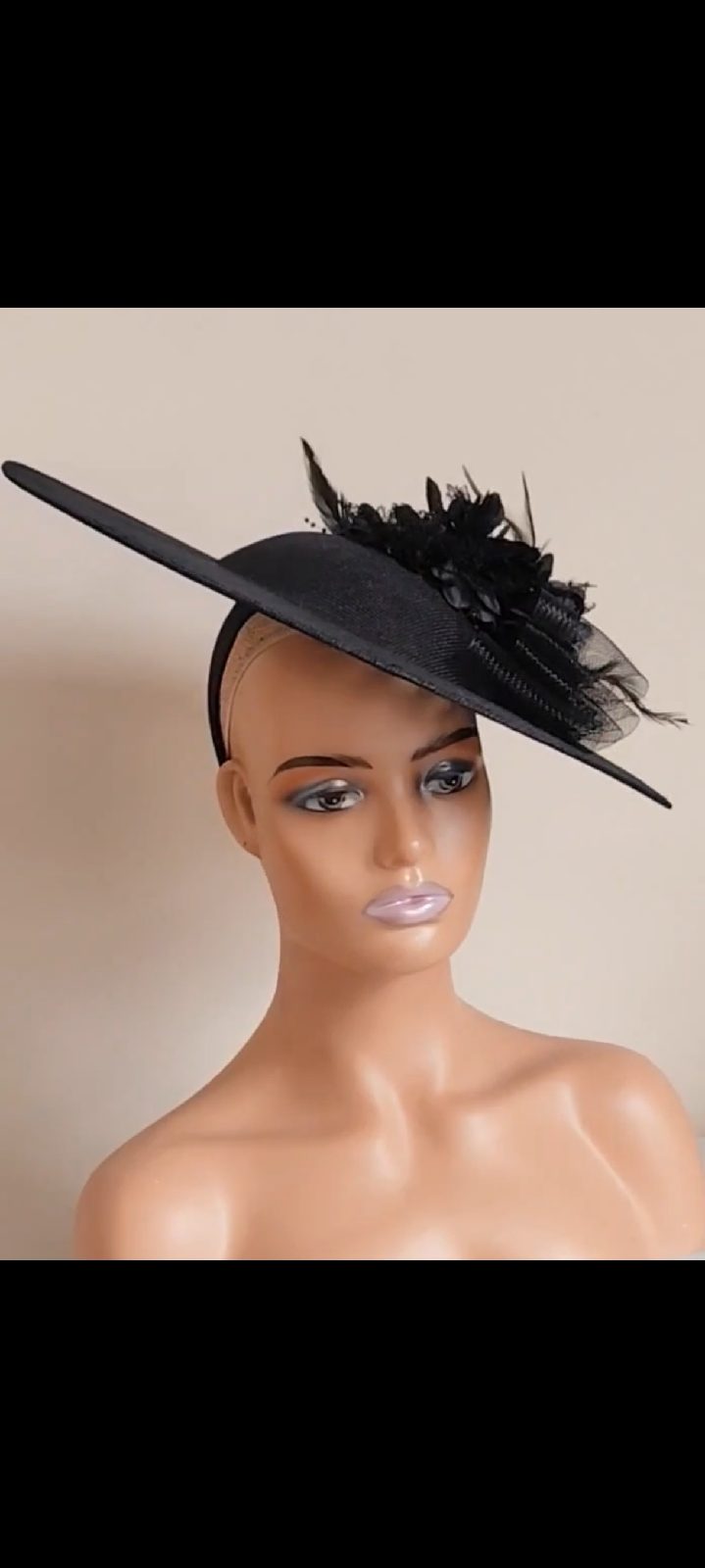 Elegant black fascinator hat perfect for special day, wedding ascot races