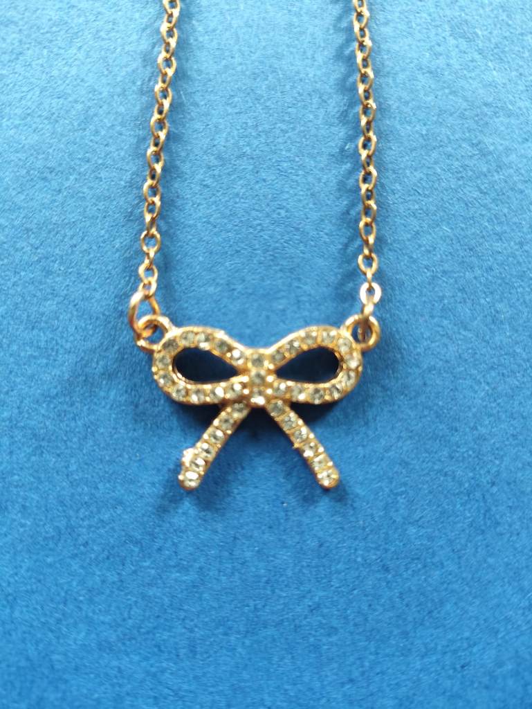 Gold Tone Diamante Bow Pendant Necklace