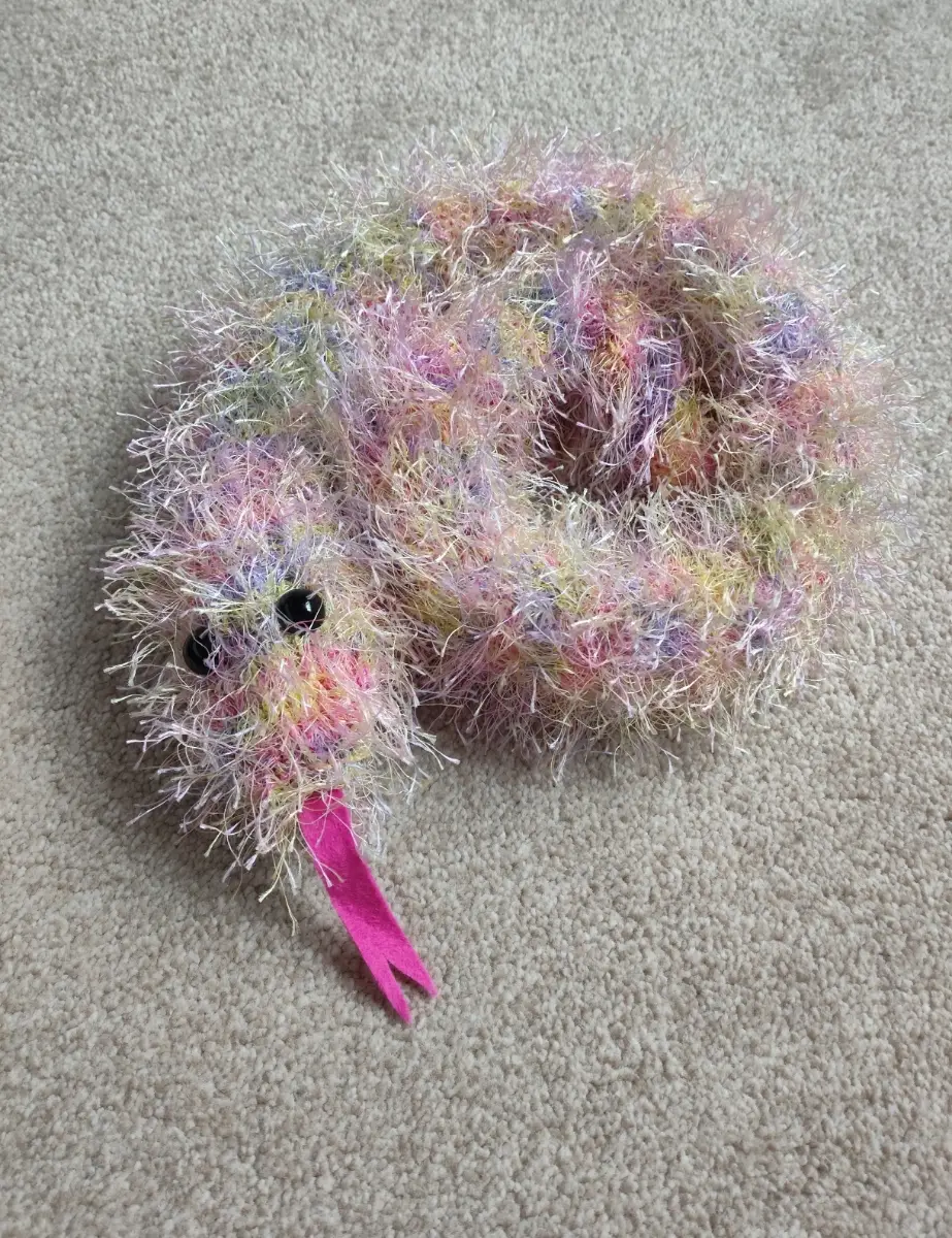 Hand knitted colourful snake