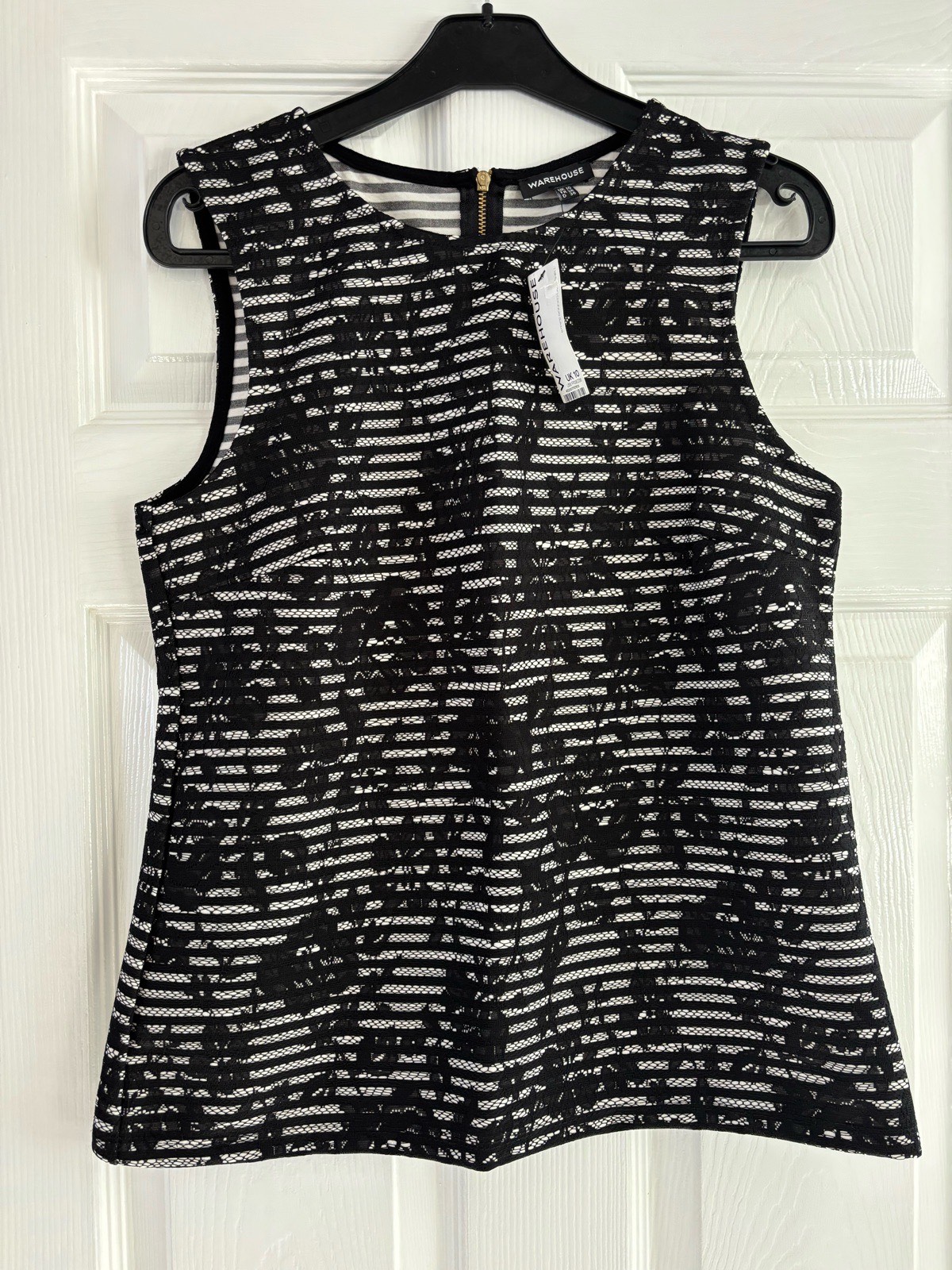 Brand new with tags (BNWT) sleeveless top from Warehouse
