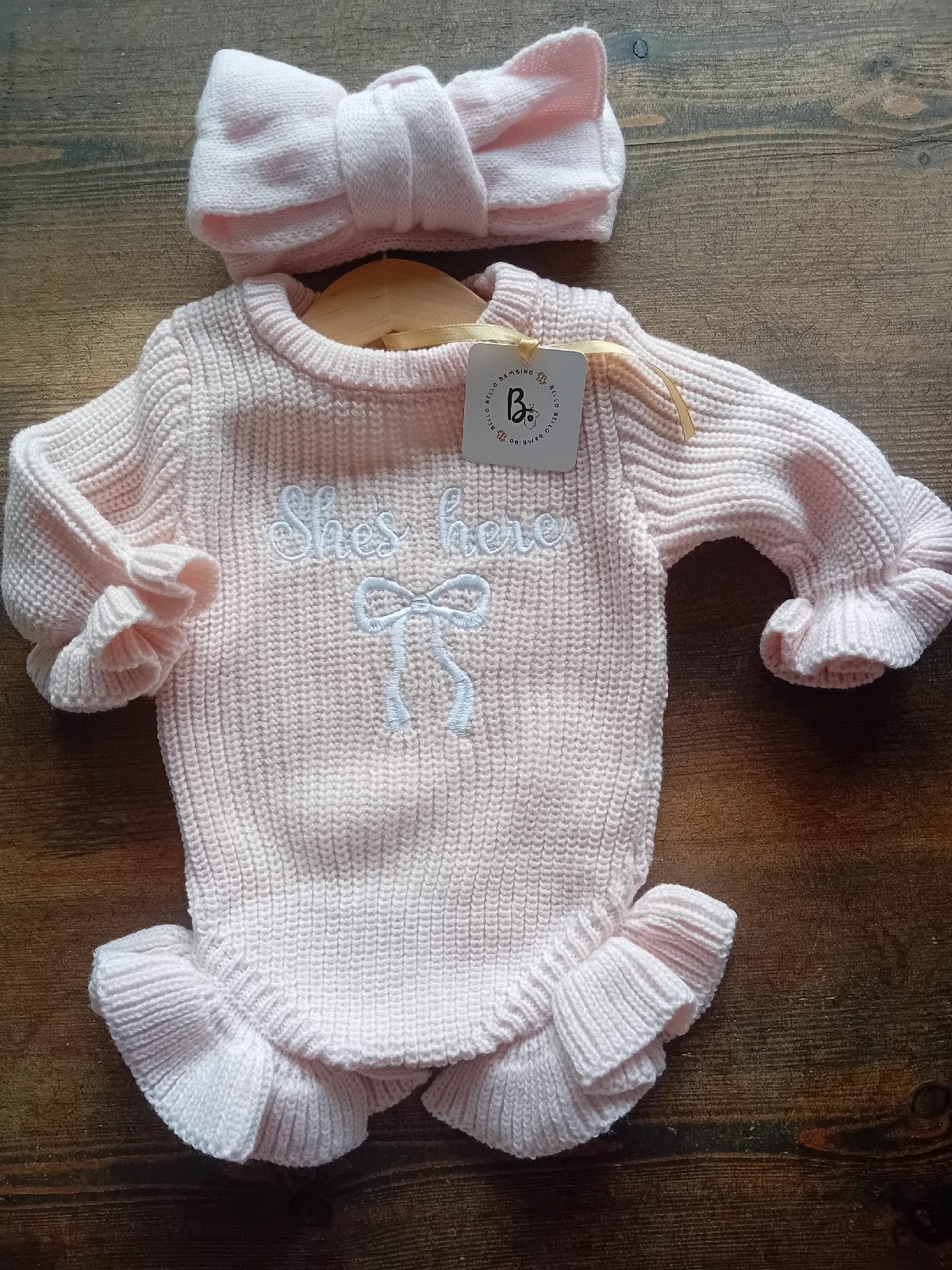 Girls 'she's here' knitted romper & bow pale pink newborn