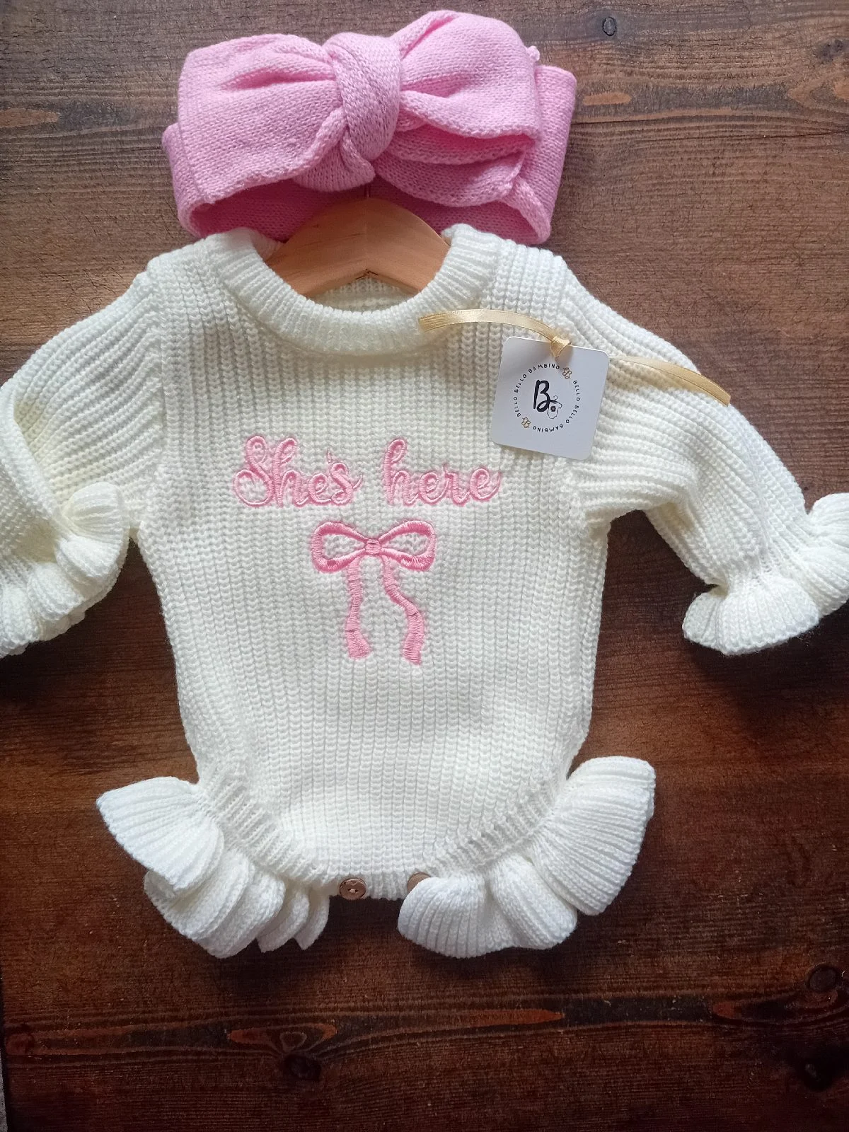 Girls 'she's here' knitted romper with bow newborn