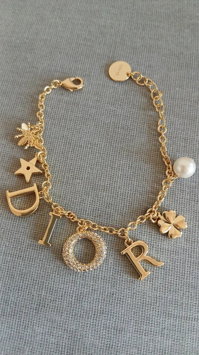 Gold-tone multi charm women bracelet - Adjustable size
