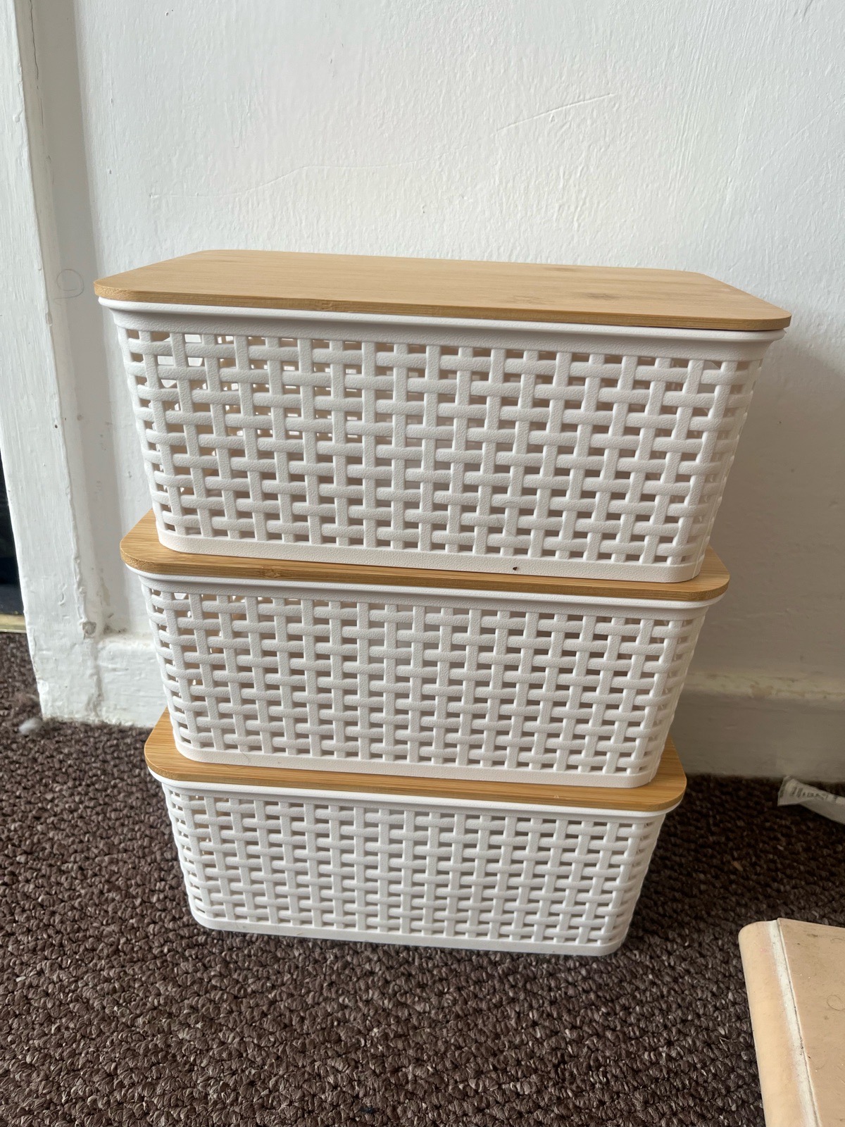 white storage baskets with bamboo lids