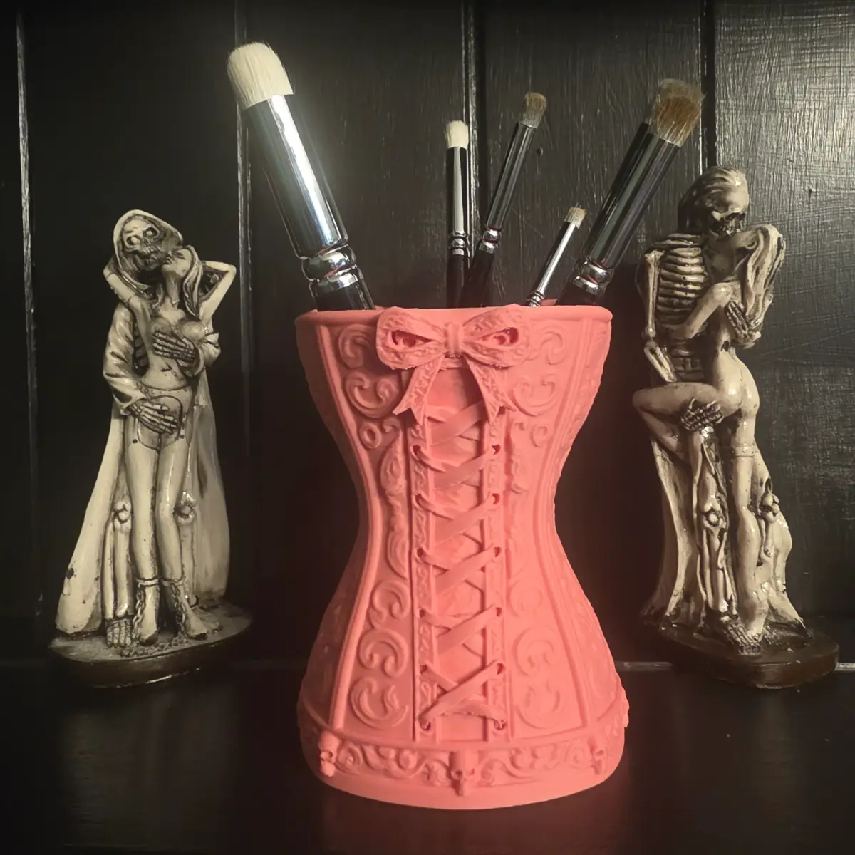 Pink gothic corset makeup brush holder