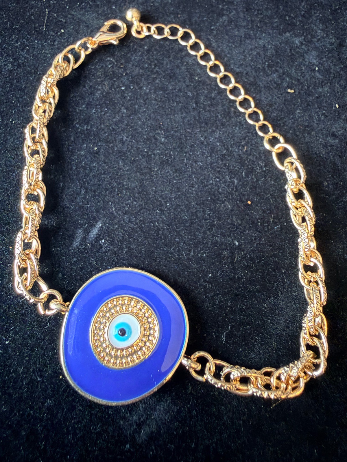 Bracelet featuring a bold blue evil‑eye charm