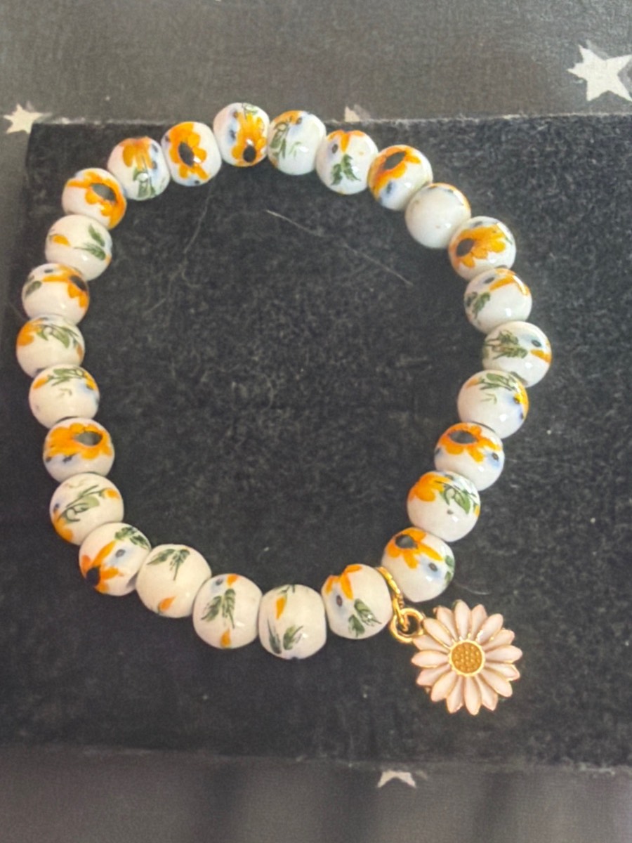 Handmade sunflower bracket with flower charm
