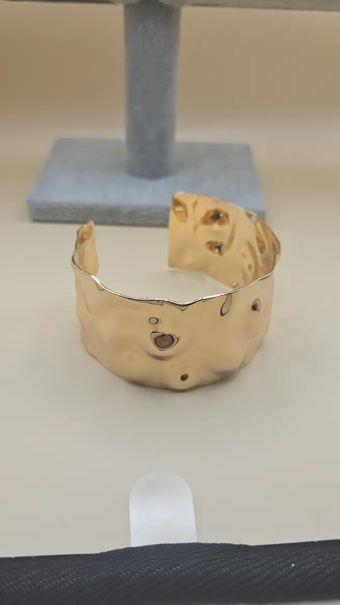 Unique gold tone cuff bangle