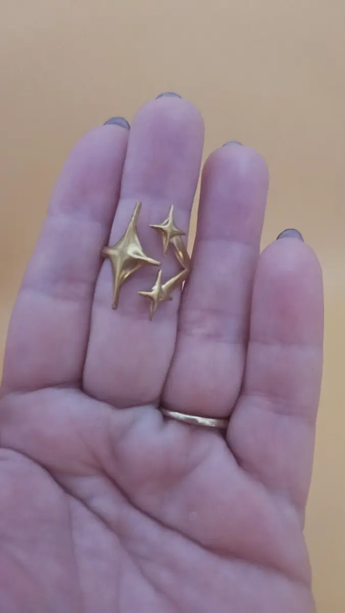 Punk style stars open ring in gold tone
