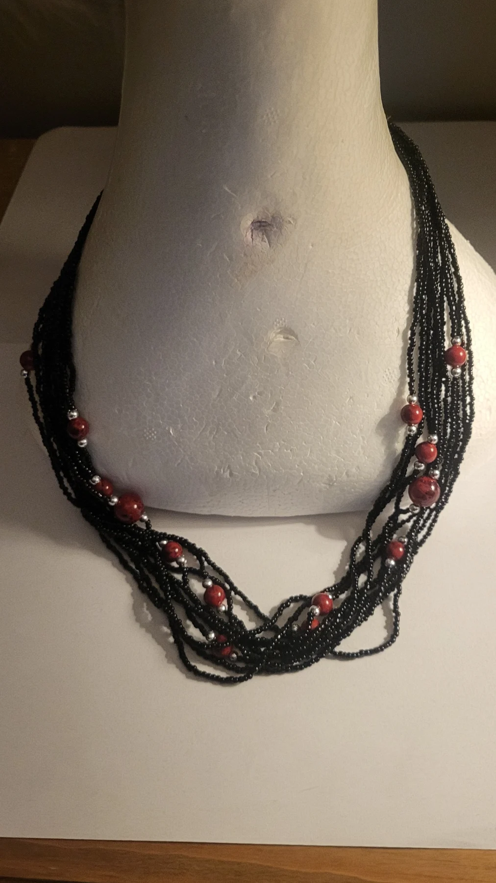 Black Multi-strand beaded necklace with red & silver beads